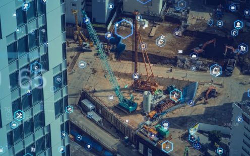 Aerial view of construction site with symbols in hexagons appearing as overlay.